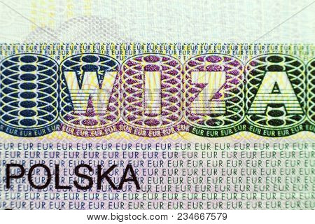 Close Up Of Visa In Passport. Poland Of Shengen Travel Concept.