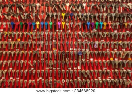 Blurred Red Wall With Many Different Keys Background
