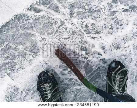 Hockey Player With Stick On The Ice Texture Close
