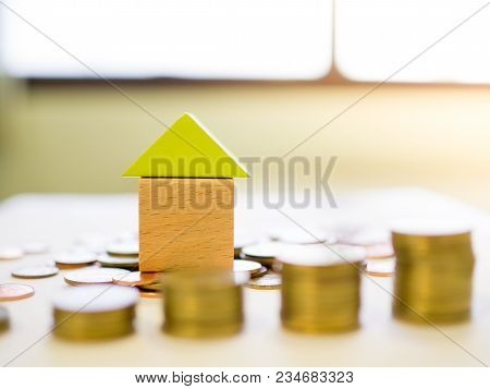 Coins And Blocks - Close Up Small Blocks House With Stack Of Coins, Business Concept, Financial Conc