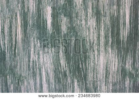 Texture Of Green And White Paint On An Iron Surface