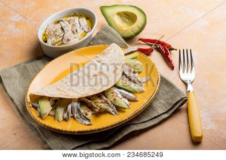 piadina with avocados marinated anchovies and hot chili pepper
