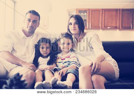 happy young family relax and have fun at modern home indooor