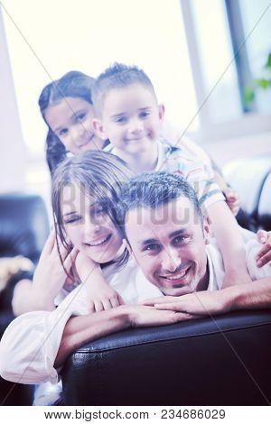 happy young family relax and have fun at modern home indooor