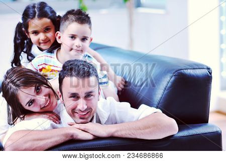 happy young family relax and have fun at modern home indooor