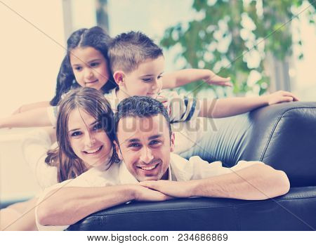happy young family relax and have fun at modern home indooor