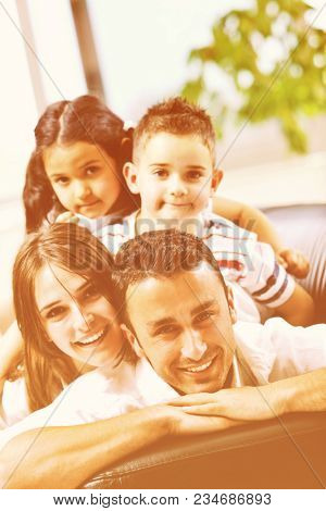 happy young family relax and have fun at modern home indooor