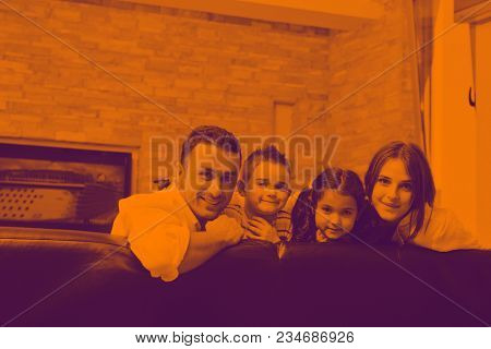 happy young family relax and have fun at modern home indooor duo tone