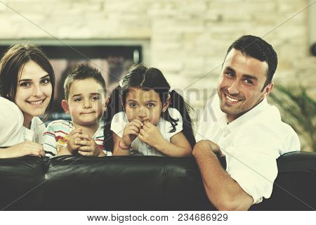 happy young family relax and have fun at modern home indooor