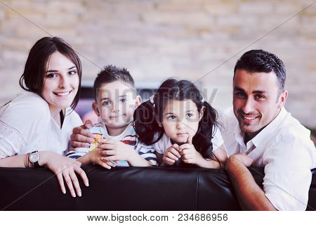 happy young family relax and have fun at modern home indooor