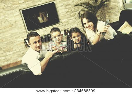 happy young family relax and have fun at modern home indooor