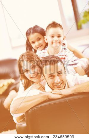 happy young family relax and have fun at modern home indooor