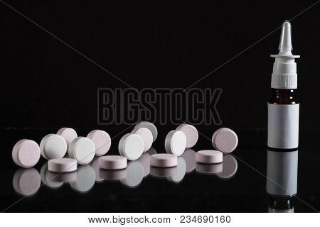 Pill Bottle And Pills In Isolated On Black Concept Pharmacy. With Copy Space.