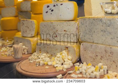 Variety Of Cheese On The Store Counter. Food