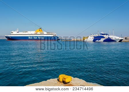 Naxos, Greece - May 23, 2017: Two Ferries In Port Of Naxos Town. Blue Star Ferries And Seajets Cycla