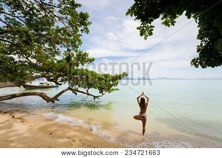Tropical Summer Yoga Session On Beautiful Sunset Beach, Koh Kradan Island In Thailand. Vriksha Asana