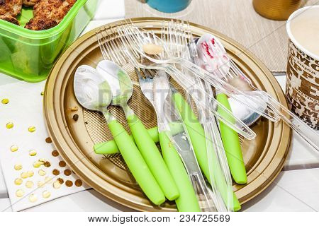 Used Plate With Salad And Cutlery After The Party