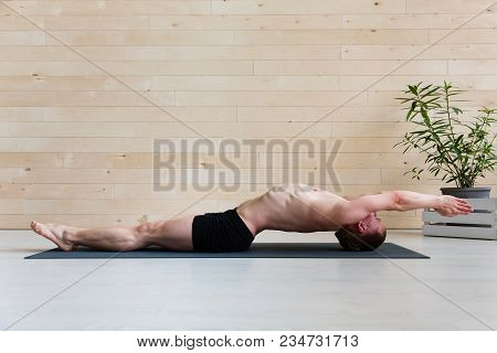 Sporty Man Practicing Yoga. Matsyasana, Fish Posture
