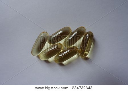Handful Of Softgel Capsules Of Fish Oil