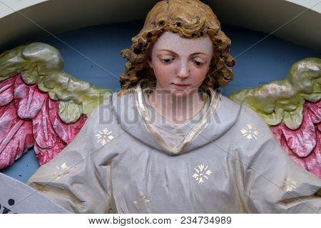 STITAR, CROATIA - NOVEMBER 30: Angel with Gloria in excelsis Deo Banner, Nativity Scene, altarpiece in the church of Saint Matthew in Stitar, Croatia on November 30, 2017.