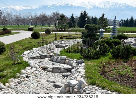 Japanese Garden In Asia, Stone River And Mountains