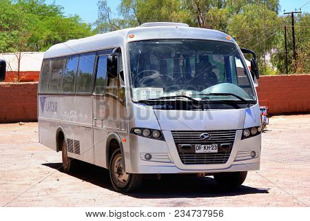 San Pedro De Atacama, Chile - November 17, 2015: Grey Touristic Bus Volare W9 In The Town Street.