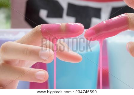 Hand Holding Homemade Plaything Called Slime, Teenager Having Fun And Being Creative Homemade Toy, S