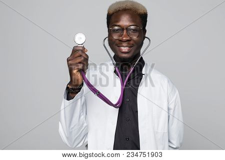Portrait Of Handsome Afro American Doctor With Sthethoscope In White Coat Looking At Camera, Isolate
