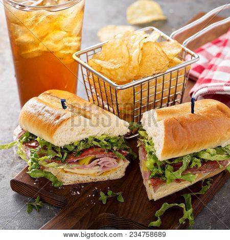 Italian Sub Sandwich With Salami, Ham And Chips With Copy Space