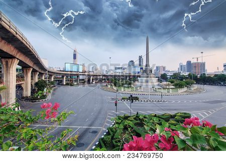 Thunderclap With Black Cloud At Victory Monument Landmark In Bangkok