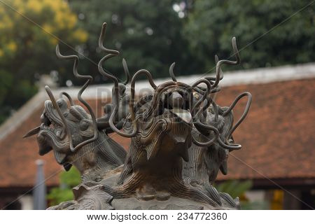Three Headed Dragon Made Of Bronze With Glass Ball In Their Mouth On The Top Of The Antique Incense 