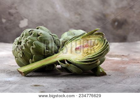 Artichokes On Grey Background. Fresh Organic Artichoke Flower.
