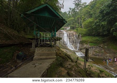 Lata Iskandar, Perak, Malaysia. March 25, 2018. A Lady Taking A Rest At A Lata Iskandar Waterfall, L
