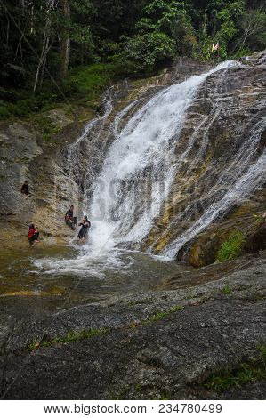 Lata Iskandar, Perak, Malaysia. March 25, 2018. A Lady Taking A Rest At A Lata Iskandar Waterfall, L