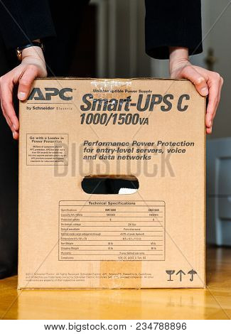 Paris, France - Mar 29, 2018: It Woman Unboxing Apc Smart-ups C 1000va Lcd 230v Enterprise-level Uni