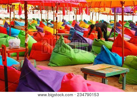 Indonesia, Bali Island, Beach In Kuta - October 01, 2017: Сafe Worker Is Preparing To Open A Restaur