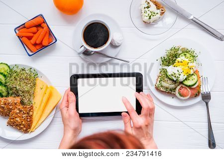 Close Up Female Hands Holding Tablet With Blank Copy Space Screen And Having Healthy Breakfast And C
