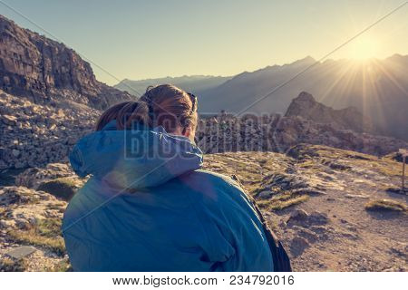 Female Hiker Looking At Sunset. Enjoying Spectacular Mountain View.