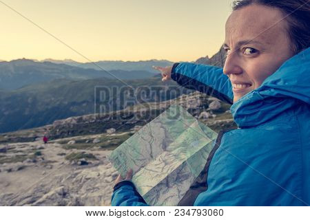 Female Hiker Showing The Way. Exploring Brenta Dolomites, Italy.