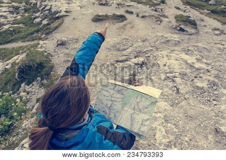 Female Hiker Showing The Way. Exploring Brenta Dolomites, Italy.