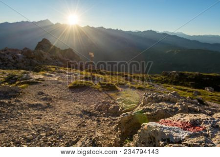 Mountain Direction Sign Light By Setting Sun. Brenta Dolomites.