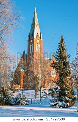 The Evangelical Lutheran Church Of Red Brick On The Background Of Blue Sky In The Finnish Town Of Fo