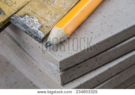 Laying And Cutting Tiles. Tools And Building Materials At A Working Position. Tiles For Industrial A