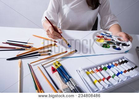 Female Artist Painting On Canvas Paper