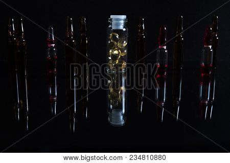 Pill Bottle And Pills In Isolated On Black Concept Pharmacy. With Copy Space.