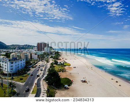 Drone Photo Of Barra Da Tijuca Beach, Rio De Janeiro, Brazil. We Can See The Beach, Some Building, T