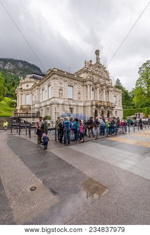 Editorial: LINDERHOF, BAVARIA, GERMANY, June 6, 2017 - Many tourists visit Linderhof Palace even in bad weather.