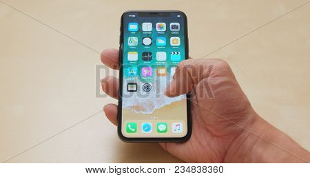 Hong Kong, Hong Kong, 01 March 2018:- Hand holding IphoneX 