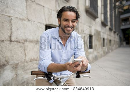 Young Happy Attractive Hispanic Man In Casual Trendy Clothes Smiling Cheerful Using Mobile Phone On 