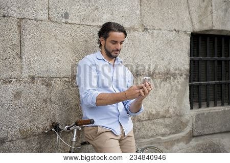 Young Happy Attractive Hispanic Man In Casual Trendy Clothes Smiling Cheerful Using Mobile Phone On 